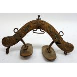 A Tibetan carved wooden saddle, 24 x 25cm