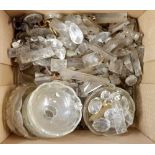 A box of cut glass lustres and light pans