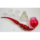 A Nailsea cranberry glass pipe, 43cm long, a pair of Waterford glass candlesticks and moulded
