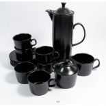 A Wedgwood mid century black coffee set with six cups and saucers, milk and sugar containers