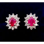 A pair of 18 carat gold ruby and diamond cluster earrings , 9mm x 7mm