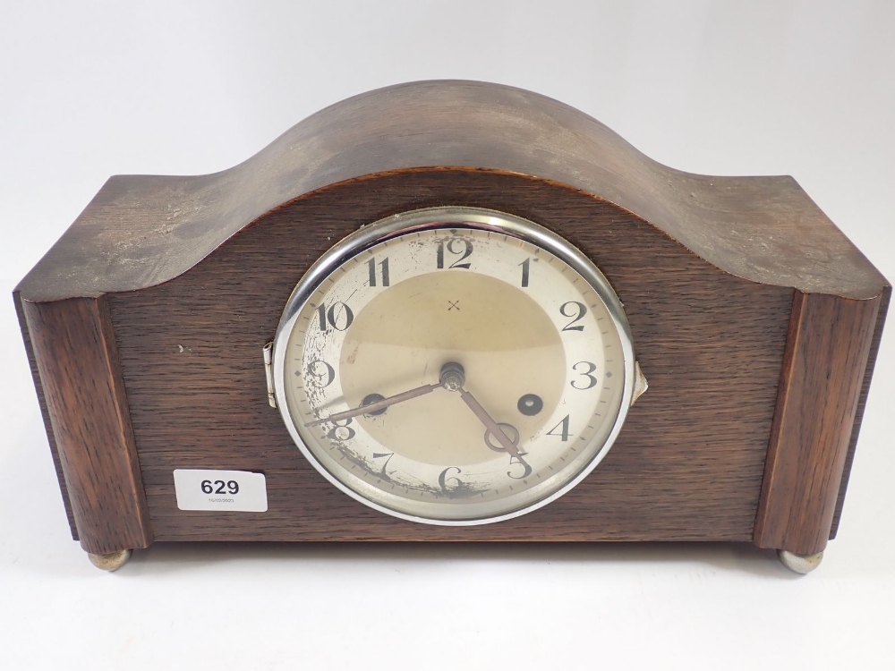 A German 1930's oak cased mantel clock, 33cm wide