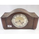 A German 1930's oak cased mantel clock, 33cm wide