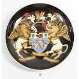 A Groves pottery dish with winged cow armorial 'The Worshipful Company of Butchers' 30cm diameter