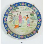 A 20th century Chinese polychrome plate, painted three ladies in landscape, 34cm