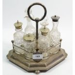 A silver plated six bottle cruet stand, complete