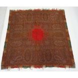 An antique paisley woven wool shawl with central red panel 180cm square