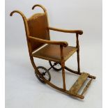 An Edwardian oak framed wheelchair