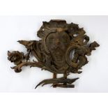 An 18th century carved wood large shield form armorial, probably from an entrance or gateway, a/f,