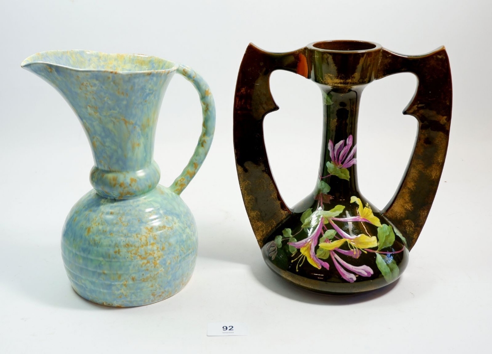 A Victorian Aesthetic two handled vase painted flowers, 24cm and a 1930's blue mottled jug