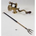 A Victorian brass mincer and an extending toasting fork