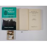 A group of Border Regiment military buttons and two books on the Border Regiment