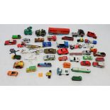 A box of die cast cars etc.