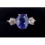 A fine 18 carat gold sapphire and diamond ring, the central oval cut Ceylon sapphire (measuring 3.87