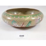 A small oriental cloisonne enamel bowl in pink and green, 21cm diameter