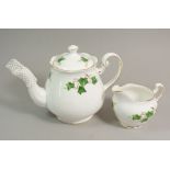 A Coclough Ivy tea service comprising eight cups and seven saucers, teapot, milk, sugar, four bowls,
