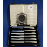 A set of six silver handled tea knives, Sheffield 1948, boxed and a small silver photograph