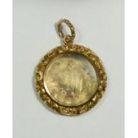A Victorian gold circular locket pendant with floral border (unmarked but tested as gold) total