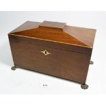 A 19th century mahogany tea caddy with paw feet and fitted two caddies, 30cm wide