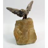 A silver plated eagle on a rock 17cm tall