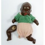 An early 20th century composite jointed black baby doll, 13.5cm