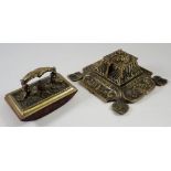 A brass foliate caste inkwell and a brass jotter