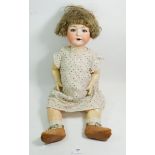 A Heubach Koppelsdorf bisque headed doll No 320.7 1/2 with sleeping eyes, 60cm