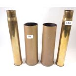 Four brass shell cases