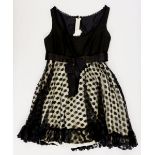 A 1960s Jean Varon black mini baby doll dress with net spotted skirt, size 10