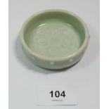 A Chinese celadon water vessel with Buddhism symbol incised to base and raised beads to rim with