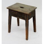 An antique elm top stool with hand cut out, 46cm high
