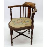 An Edwardian mahogany and marquetry corner chair on spindle supports
