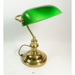 A brass and green glass banker's desk lamp
