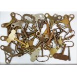 A large collection of various clock winding keys including Smiths, Enfield, Pioneer, Popular