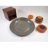 A pewter plate, wooden box with tambour front and a set of stacking boxes