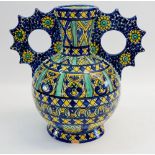 A Cantagalli two handled vase painted geometrical decoration and flower heads, 28cm signed to base