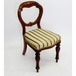 A Victorian balloon back chair on turned supports