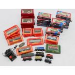 A box of Hornby wagons, mostly boxed