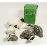 Three Beswick badgers, boxed and two Beswick sheep