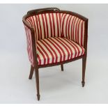 An Edwardian mahogany framed tub chair