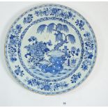 A Chinese Qing Long century blue and white charger painted garden scene, 35cm