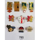 A box of badges mainly related to the Olympics