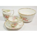 A Victorian floral printed tea service circa 1880 comprising: ten cups, twelve saucers, sugar, milk,