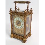A 19th century fine French brass carriage clock with pierced gilt decoration to front, with key,