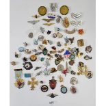 A box of assorted military badges, some reproduction