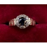 A 9 carat gold sapphire and diamond cluster ring size M to N