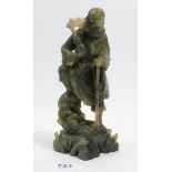 An antique Chinese carved jade figure, 17cm