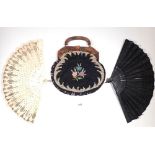 A carved bone fan with sequin decoration and a black sequin muslin fan plus a tapestry bag with