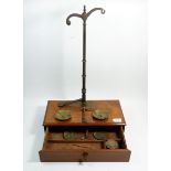 A Victorian set of brass balance scales with mahogany drawer base, 38cm wide