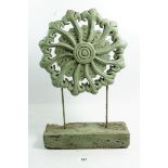 A carved wood and green stained garden decoration, 41cm